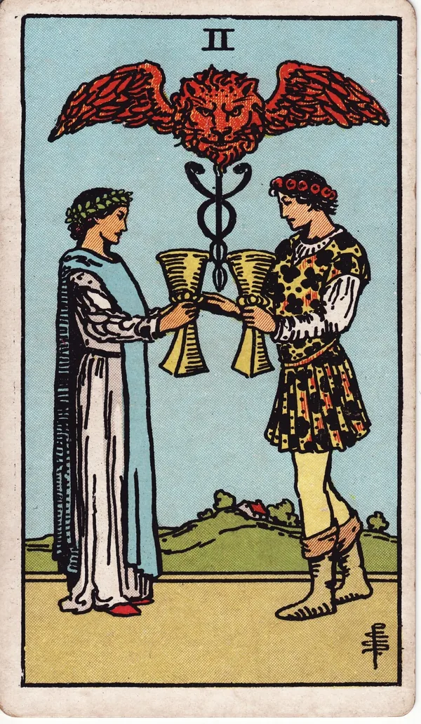 Two of Cups tarot card from the classic deck, illustrated by Pamela Colman Smith in 1909
