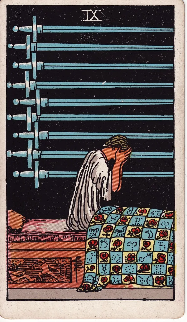 Nine of Swords tarot card from the classic deck, illustrated by Pamela Colman Smith in 1909