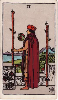 Two of Wands tarot card from the classic deck, illustrated by Pamela Colman Smith in 1909